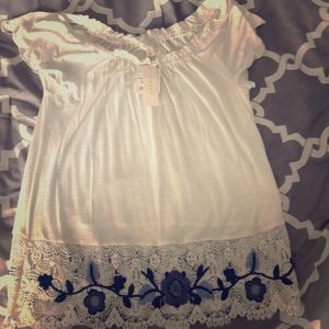 Off-shoulder blouse with embroidered bottom